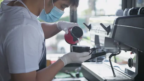 Coffee shop concept of 4k Resolution. The barista was pouring the milk over t Stock Footage 154504049