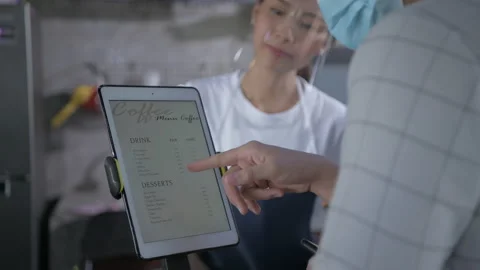 Coffee shop concept of 4k Resolution. Asian female employees are taking order Video stock 154898356