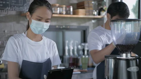 Coffee shop concept of 4k Resolution. Asian female employees are taking order Video stock 155343830
