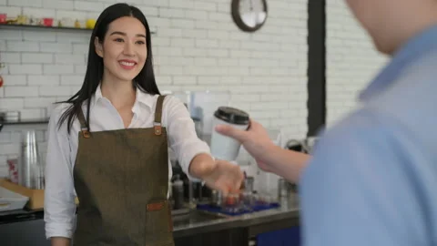 Coffee shop concept of 4k Resolution. The barista is delivering coffee mugs t Stock Footage 213457028