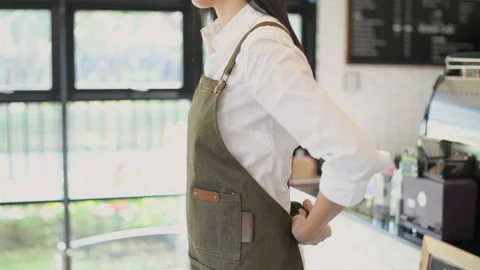Coffee shop concept of 4k Resolution. Asian women are preparing to open a sho Stock Footage 219886921
