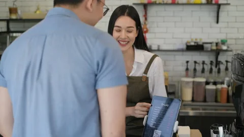 Coffee shop concept of 4k Resolution. An Asian female employee is introduci.. Stock Footage 233899624