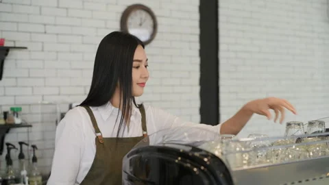 Coffee shop concept of 4k Resolution. Asian woman collecting containers in .. Stock Footage 248860159