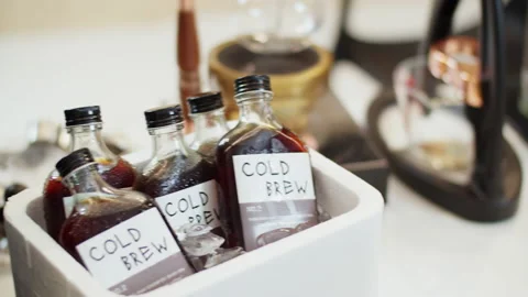 Coffee shop corner with bottled cold brew coffee soaked in ice buckets. Stock Footage 202622787
