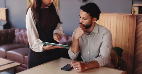 Coffee shop, customer and waitress with tablet for order, online menu and Stock Footage 330077524