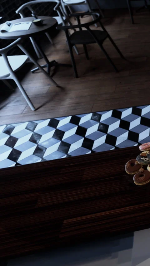 Coffee shop interior with black and white tile design and pastries Stock Footage 338349937