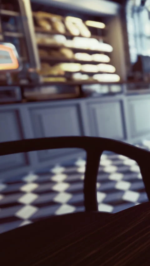 Coffee shop interior with empty chair and display case during morning hours 스톡 동영상 331667443