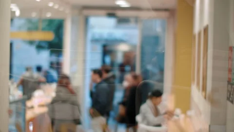 Coffee shop visitors waiting in queue, view through the glass Stock Footage 197932343