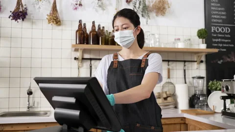 Coffee shop waitress wearing protective mask Stock Footage 205873921