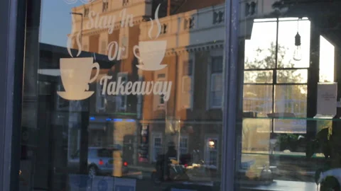 Coffee shop window reflection of traffic Stock Footage 157555559