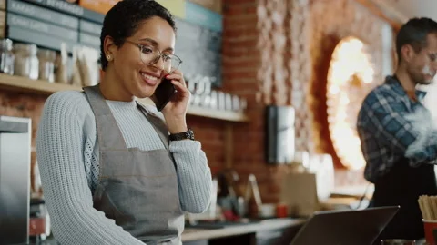 Coffee Shop Worker Taking Order Over Phone Stock Footage 143734990