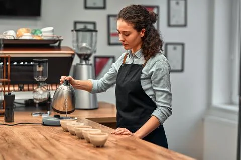 Coffee shop workers checking coffee quality during coffee food function. Side Stock Photos