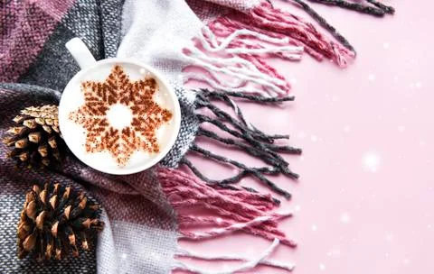 Coffee with a snowflake pattern on a warm woolen plaid Stock Photos
