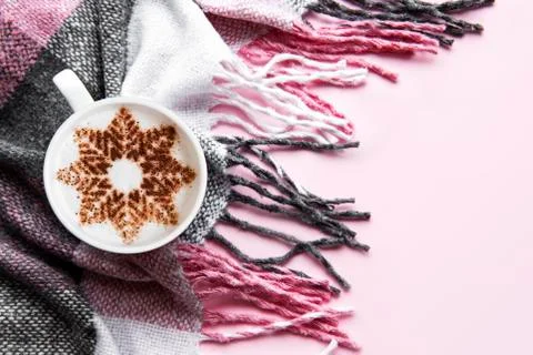 Coffee with a snowflake pattern on a warm woolen plaid Stock Photos