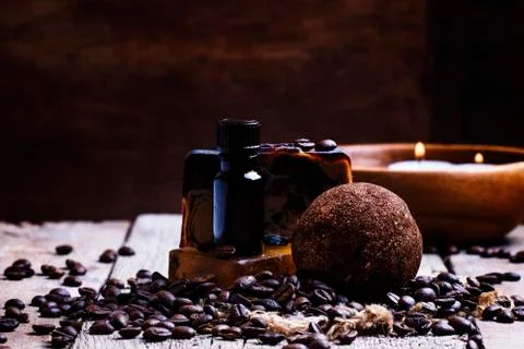 Coffee spa: soap, oil, salt, candles. Vintage wood background, selective focu Stock Photos