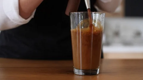 Coffee Sparkling Nitro Cold Brew Coffee pouring to glass and ready to drink. Stock Footage 89943824