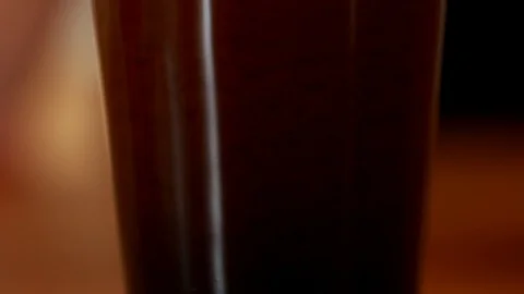 Coffee Sparkling Nitro Cold Brew Coffee pouring to glass and ready to drink. Stock Footage 89945444