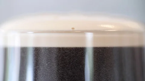 Coffee Sparkling Nitro Cold Brew Coffee pouring to glass and ready to drink. Stock Footage 90131952