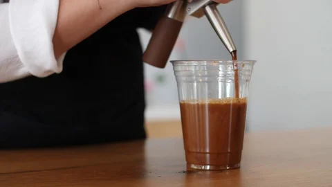 Coffee Sparkling Nitro Cold Brew Coffee pouring to glass and ready to drink. Stock Footage 90132060