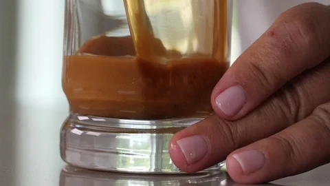 Coffee Sparkling Nitro Cold Brew Coffee pouring to glass and ready to drink. Stock Footage 94239643