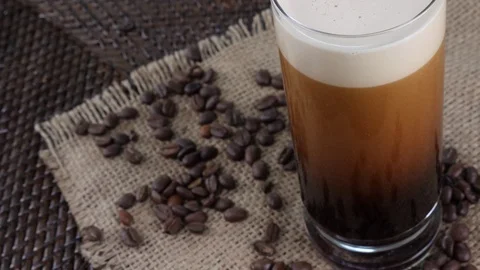 Coffee Sparkling Nitro Cold Brew Coffee pouring to glass and ready to drink. Stock Footage 94336663