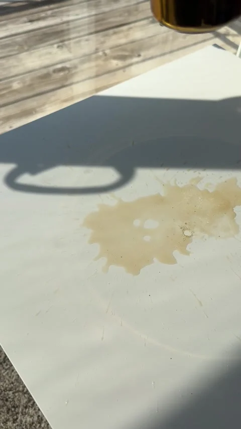 Coffee spilling onto a clean white table Stock Footage 342072950