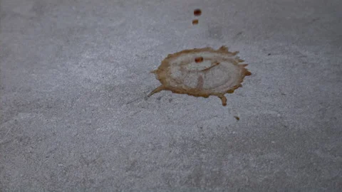 Coffee spilling onto a gray tile floor in 1000fps slow motion Stock Footage 219861980