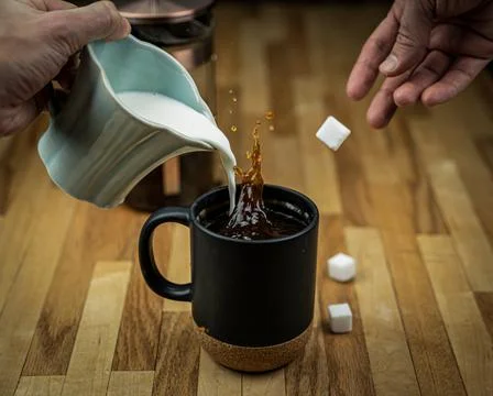 Coffee Splash with Sugar Cubes Stock Photos