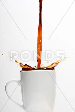 Coffee splashing Stock Photos