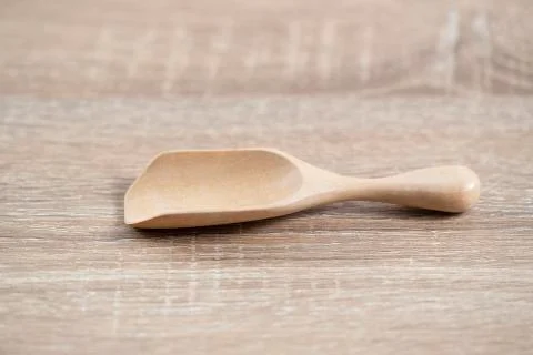 Coffee spoon on the brown table Stock Photos
