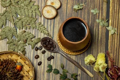 Coffee with a spoon of coffee beans Stock Photos