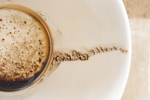 Coffee stains inside an empty beige ceramic cup, morning finish concept, so.. Stock Photos