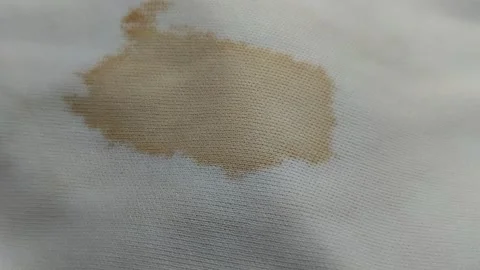 Coffee stains on white clothes. Видео 313418468