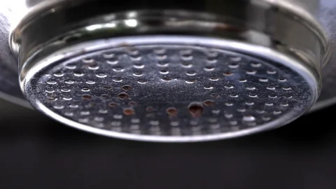 Coffee start droping from vietnam drip coffee maker close up makro shot Stock Footage 123745914