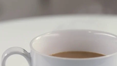 Coffee steams in this close up shot in a white cup. Stock Footage 72541018