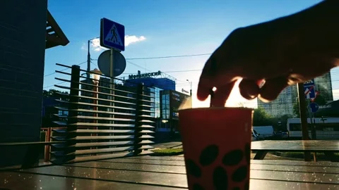 Coffee stirring sugar in the open air Stock Footage 248483282