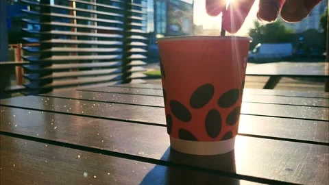 Coffee stirring sugar in the open air Stock Footage 248483327