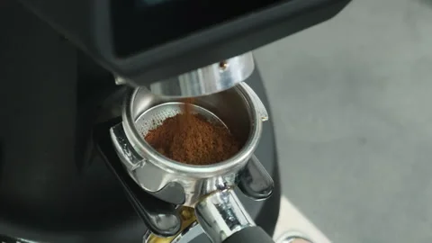 Coffee stream descends from coffee machine top into portafilter Stock Footage 306618392