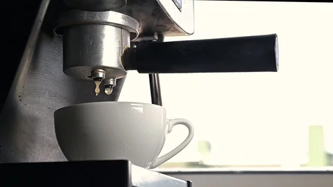 Coffee stream from machine in cup. Home making hot coffee. Stock Footage 128517486