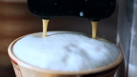 Coffee stream from professional machine in cup, making cappuccino Stock Footage 124530834