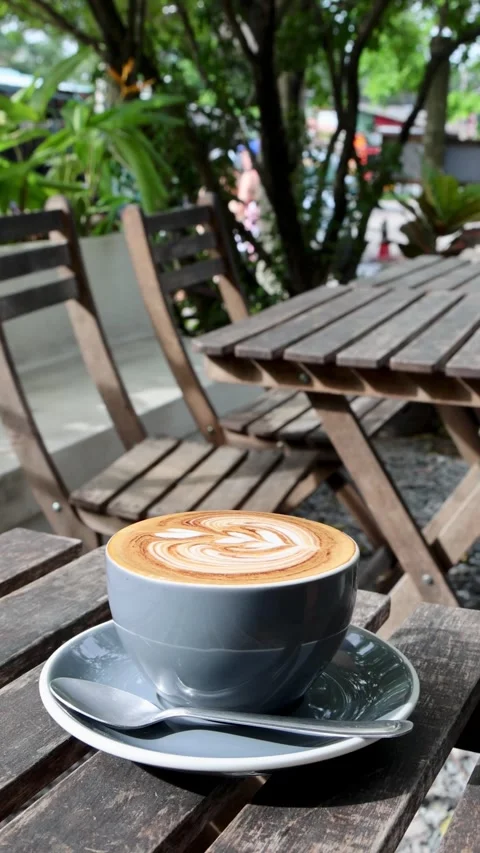 Coffee in the Sun at a Cozy Café Stock Footage 324592783