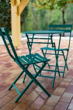 Coffee table and two chairs on the terrace. Stock Photos