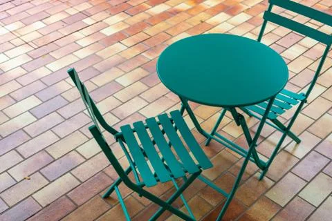 Coffee table and two chairs on the terrace Stock Photos