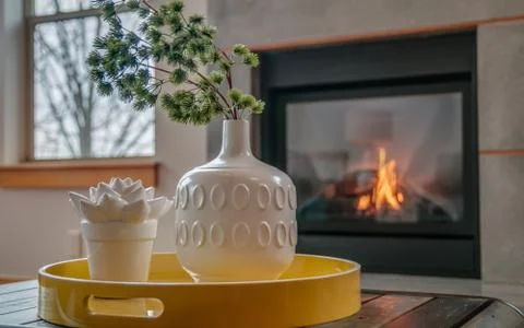 Coffee table centerpiece in front of fireplace Stock Photos