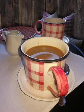 Coffee table with coffee cup, plates and milk jug. coffee with m Stock Photos