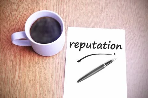 Coffee on the table with note writing reputation Foto stock