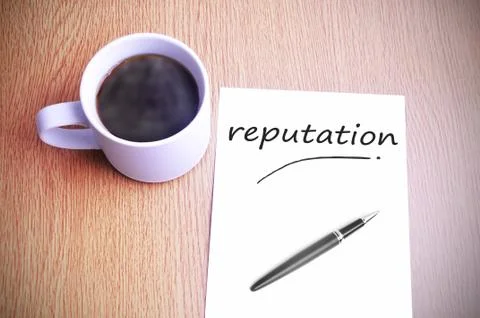 Coffee on the table with note writing reputation Stock Photos