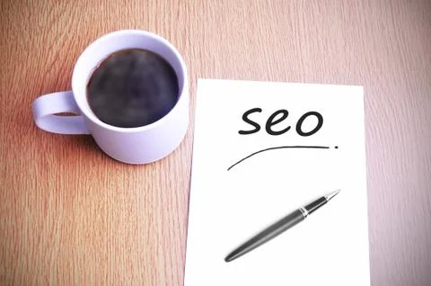 Coffee on the table with note writing seo Foto stock