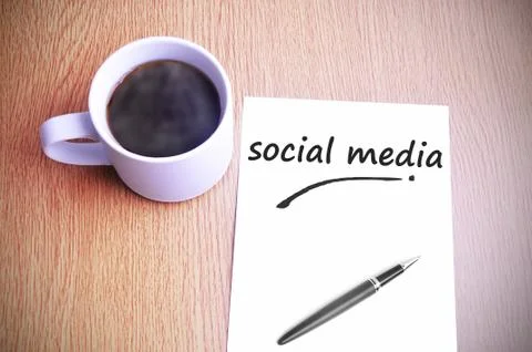 Coffee on the table with note writing social media Foto stock