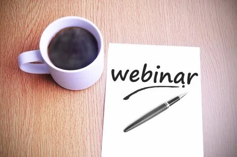 Coffee on the table with note writing webinar Fotos Stock